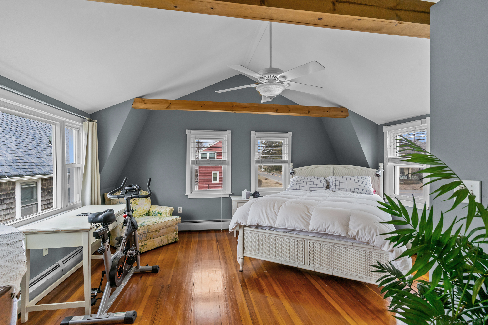 76 New Shore Road Waterford, CT 06385 - Photo 13 of 23 a spacious bedroom with a bed and a chandelier