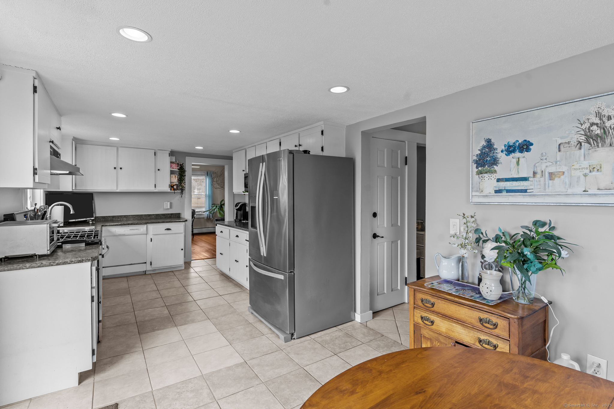 76 New Shore Road Waterford, CT 06385 - Photo 16 of 23 a kitchen with stainless steel appliances a refrigerator and a stove top oven