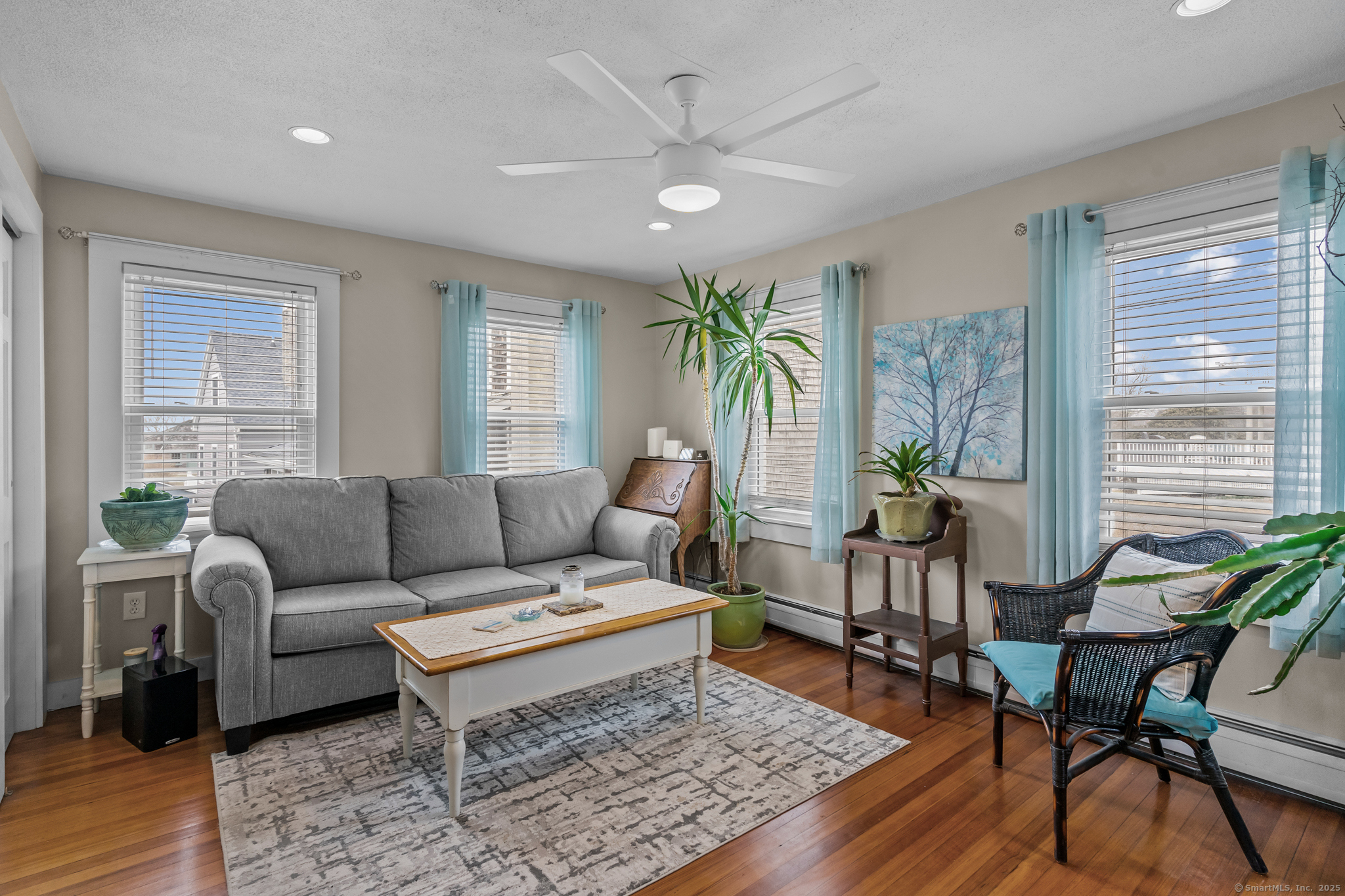 76 New Shore Road Waterford, CT 06385 - Photo 5 of 23 a living room with furniture and a large window