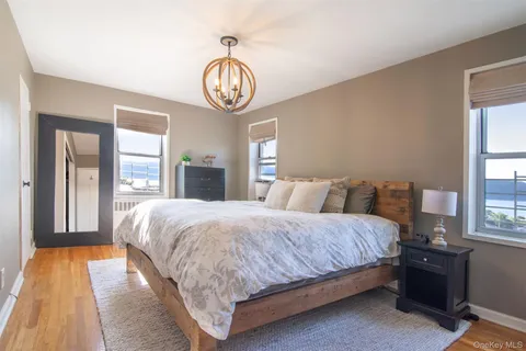 a bedroom with bed and window