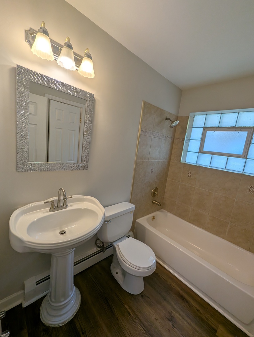 4303 South Harlem Avenue, Unit 6 Stickney, IL 60402 - Photo 11 of 13 a bathroom with a toilet sink and mirror