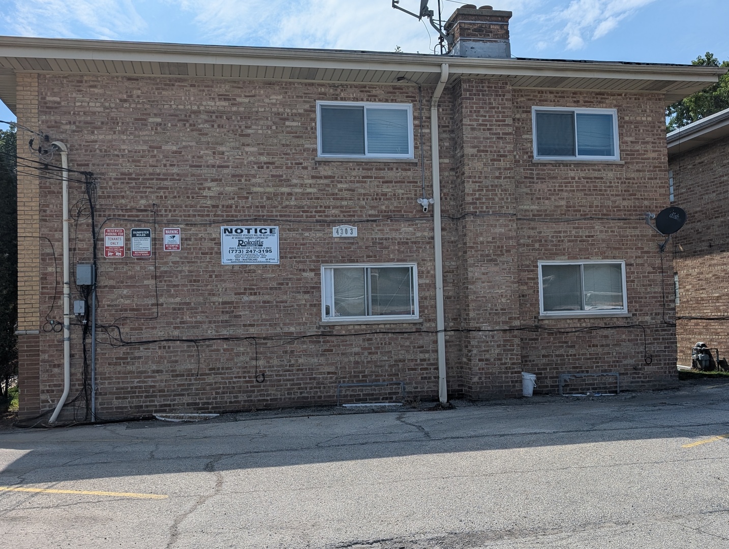 4303 South Harlem Avenue, Unit 6 Stickney, IL 60402 - Photo 12 of 13 a brick building with a bench in front of door