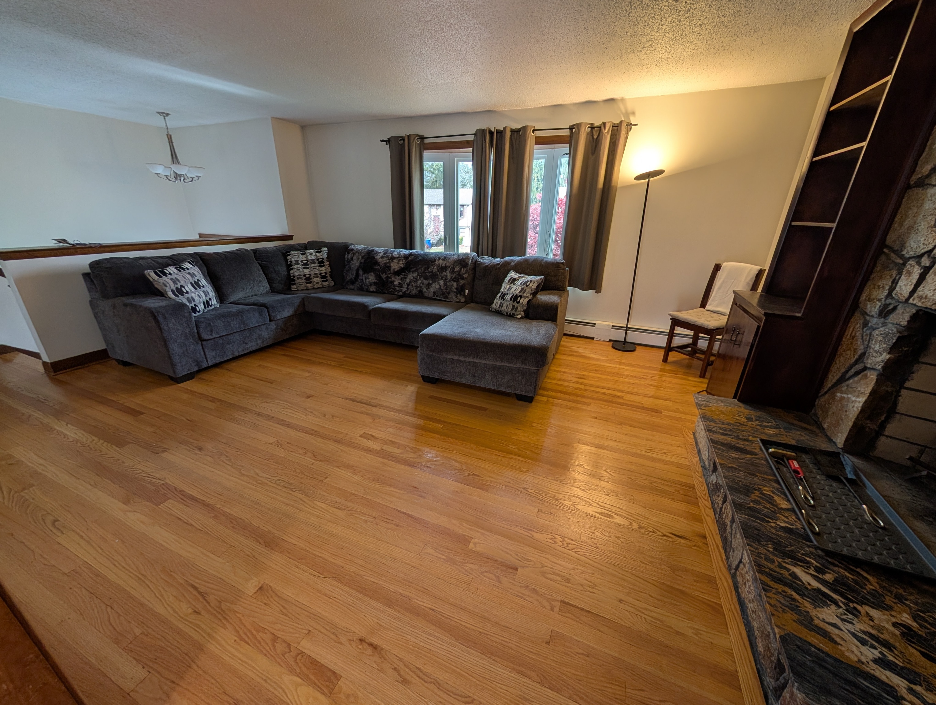 59 Pheasant Lane East Hartford, CT 06108 - Photo 4 of 8 a living room with furniture and a flat screen tv