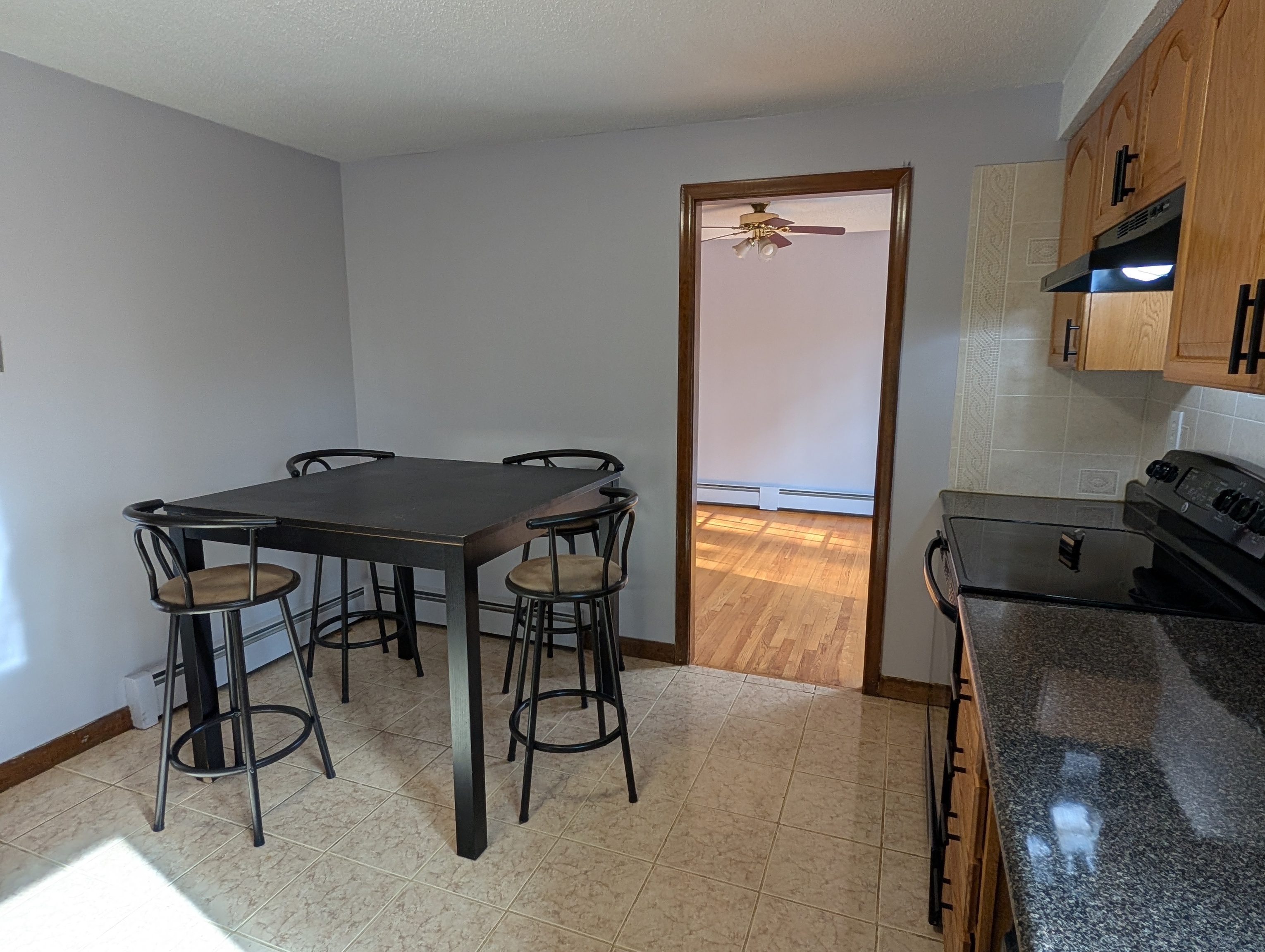 59 Pheasant Lane East Hartford, CT 06108 - Photo 7 of 8 a view of a workspace with furniture and a window