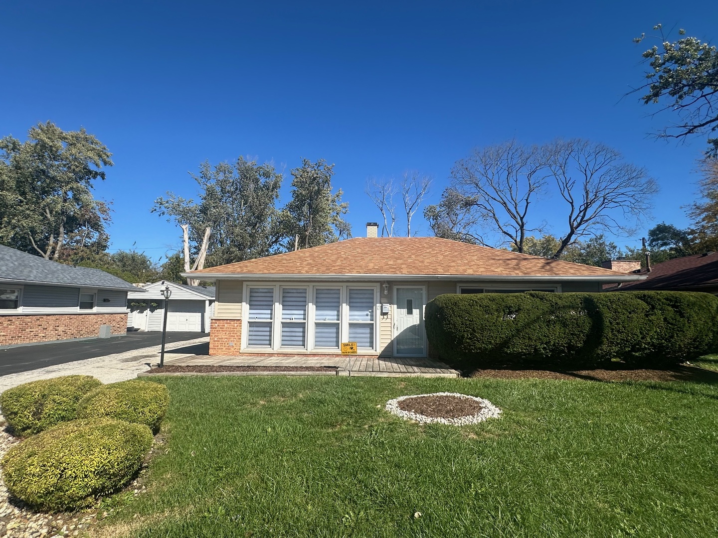 306 Mohawk Street Park Forest, IL 60466 - Photo 1 of 12 a front view of a house with a garden