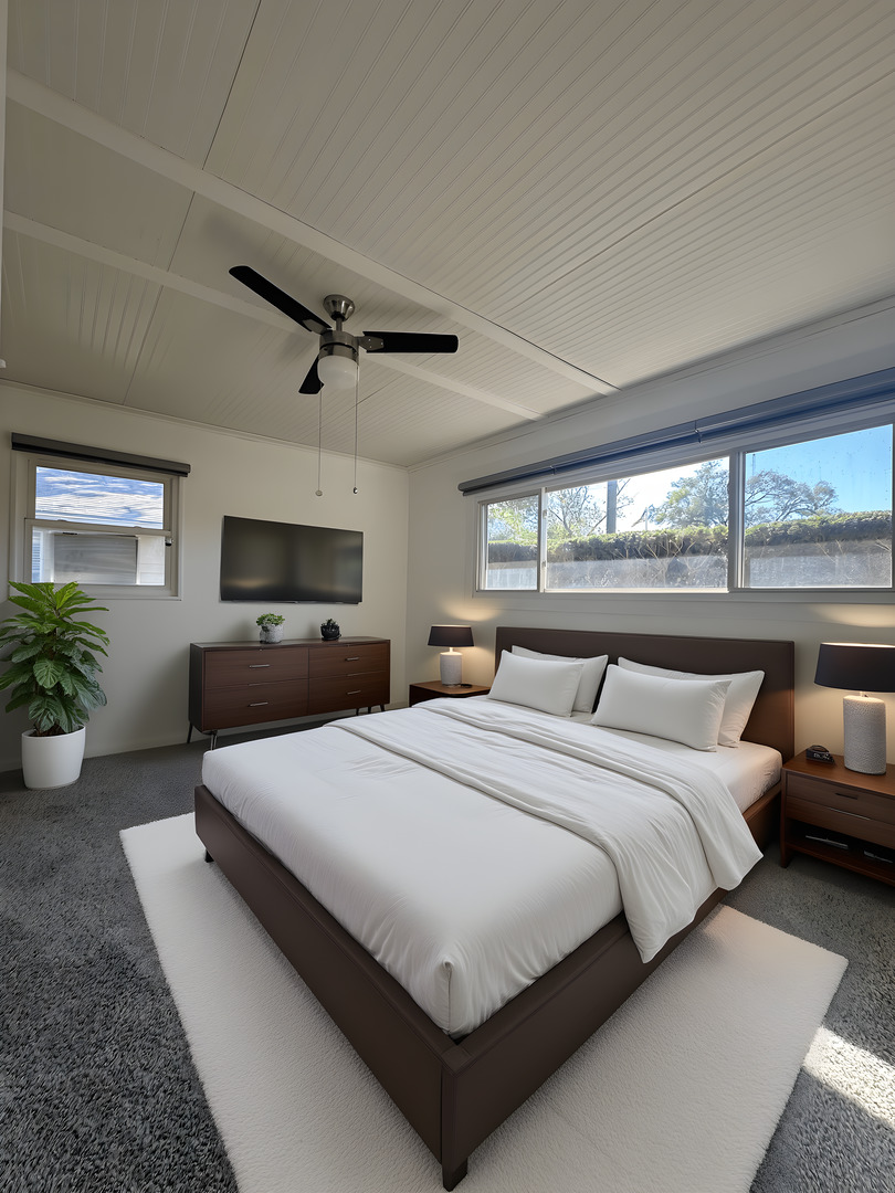 306 Mohawk Street Park Forest, IL 60466 - Photo 11 of 12 a bedroom with a large bed and a potted plant