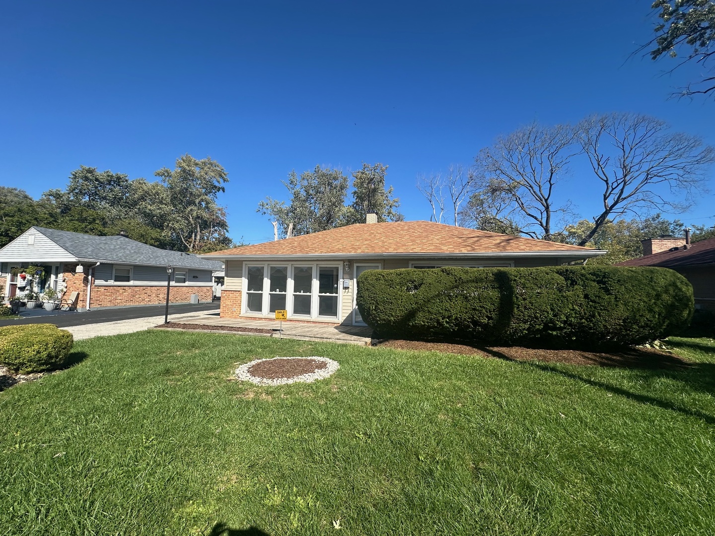 306 Mohawk Street Park Forest, IL 60466 - Photo 2 of 12 a view of a house with a yard table and chairs