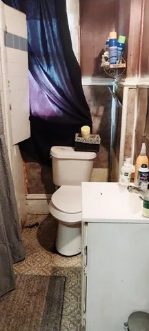 a bathroom with a toilet and a sink