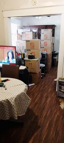 a bed room with a bed and a television