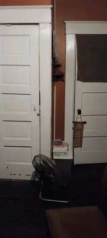 a room with a closet and a mirror