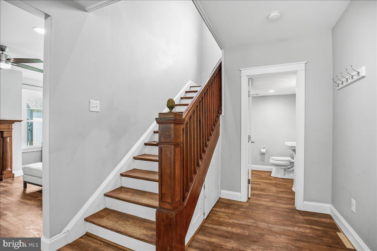 16146 Thomas Road Piney Point, MD 20674 - Photo 7 of 70 a view of an entryway with wooden floor and a bathroom view