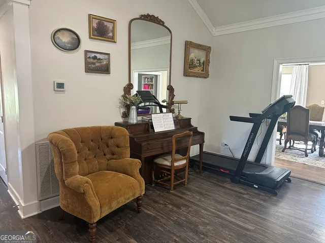 a work room with furniture and wooden floor