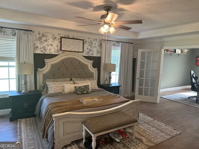 a bedroom with a bed and window