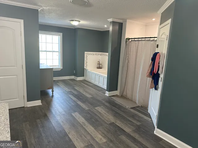 a view of entryway with wooden floor and window