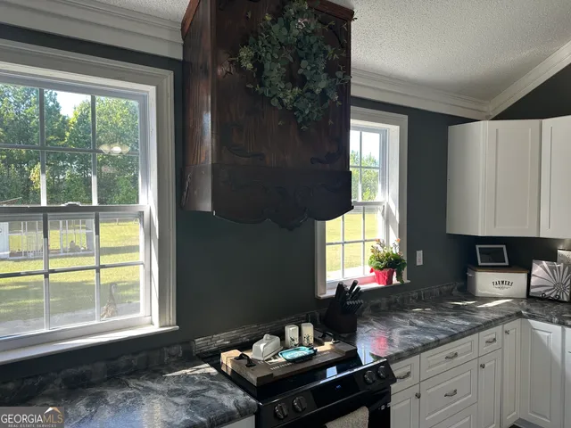 a kitchen that has a sink and a window