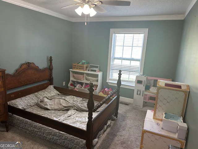 a bed room with a bed and a window