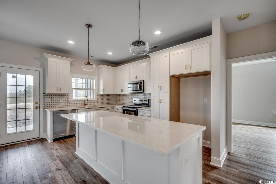 4975 Dupont Road Aynor, SC 29511 - Photo 7 of 22 Kitchen featuring white cabinetry, appliances with