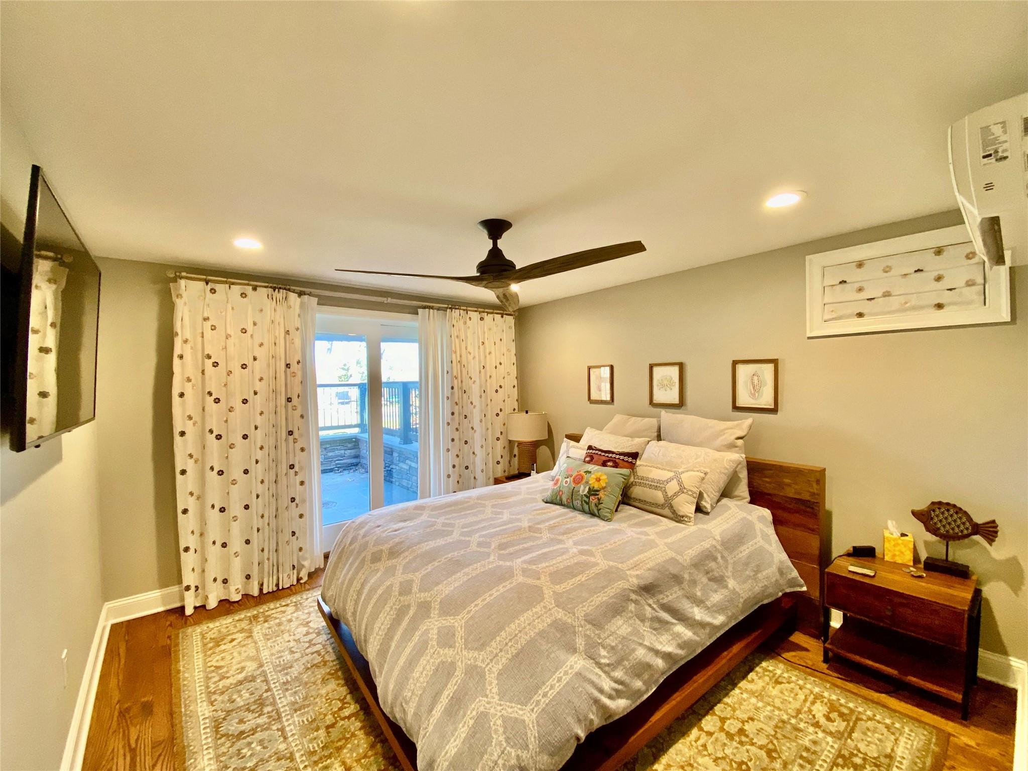 780 Minnehaha Boulevard Southold, NY 11971 - Photo 10 of 23 Bedroom featuring a ceiling fan, recessed lighting and wood finished floors