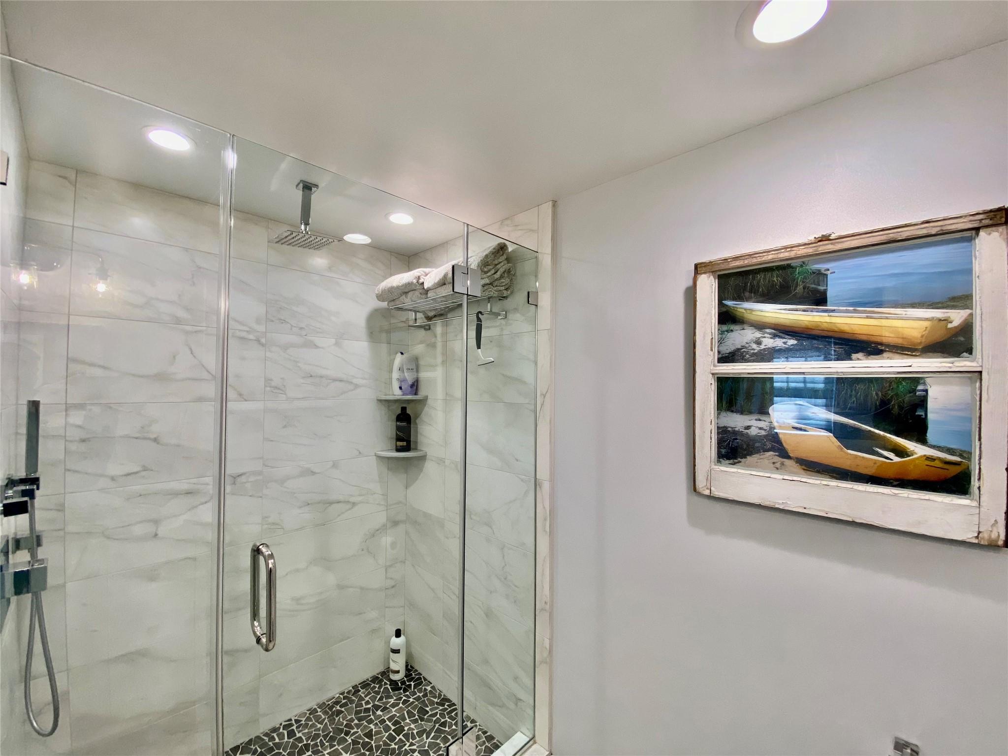 780 Minnehaha Boulevard Southold, NY 11971 - Photo 17 of 23 Bathroom featuring a stall shower and recessed lighting