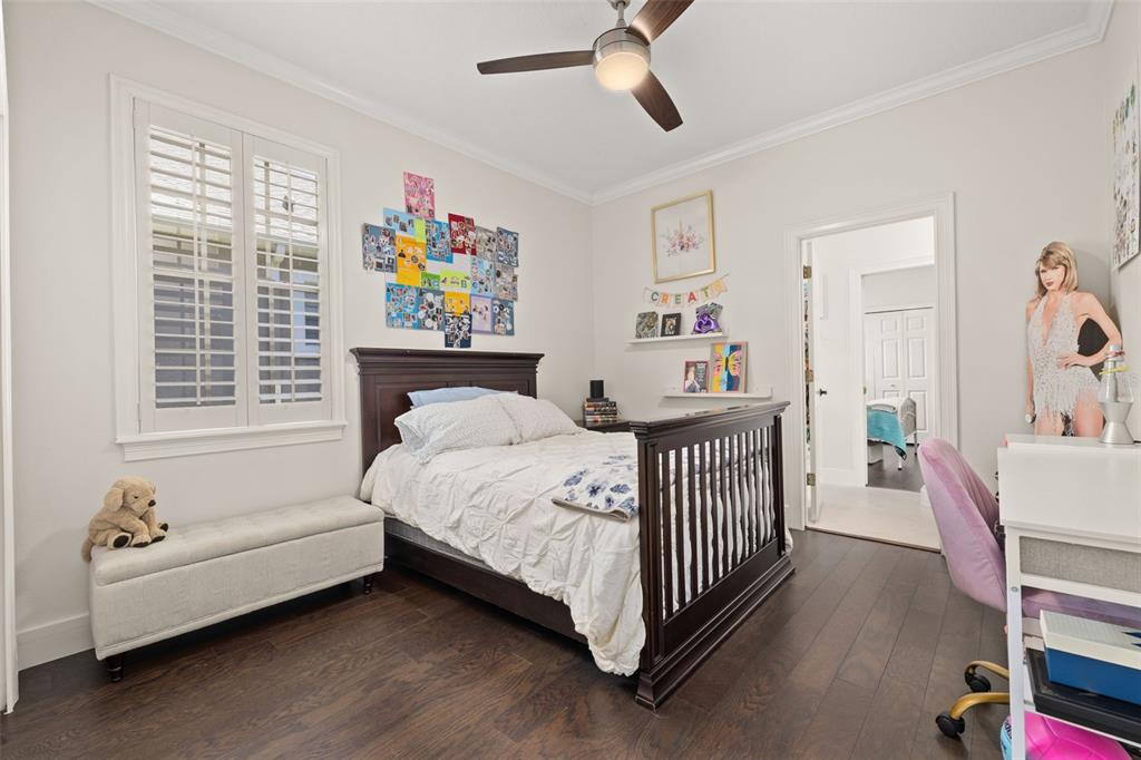 8351 Bowden Way Windermere, FL 34786 - Photo 33 of 71 a bedroom with a bed and a chandelier