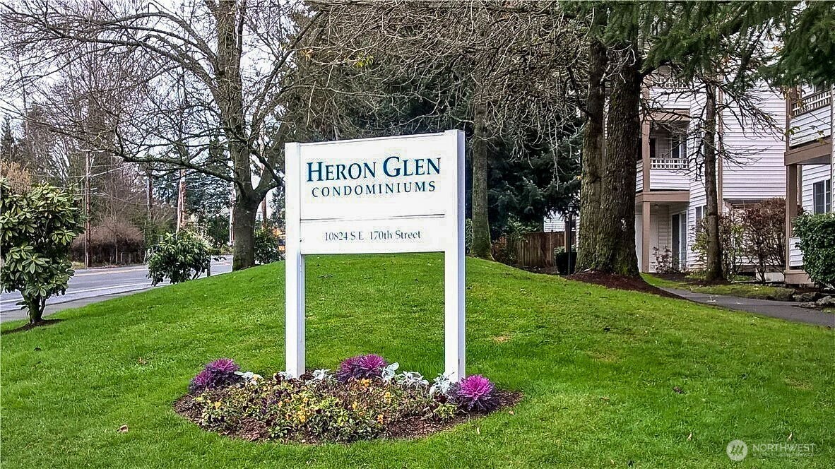 10824 Southeast 170th Street, Unit B103 Renton, WA 98055 - Photo 30 of 31 a green field with big trees