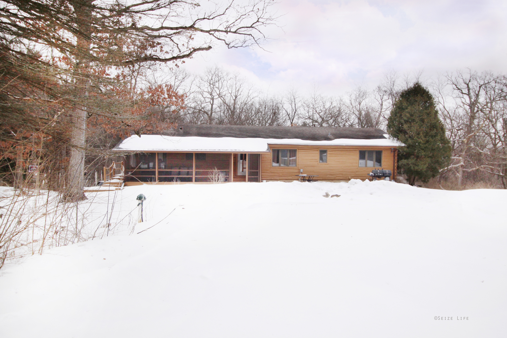 2002 Hawthorn Road Marengo, IL 60152 - Photo 2 of 27 a view of house with a yard and covered with snow in front of house
