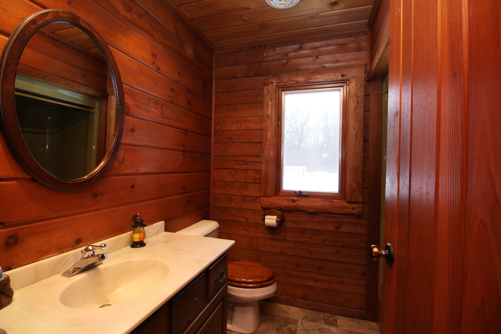 2002 Hawthorn Road Marengo, IL 60152 - Photo 16 of 27 a bathroom with a sink a toilet and mirror