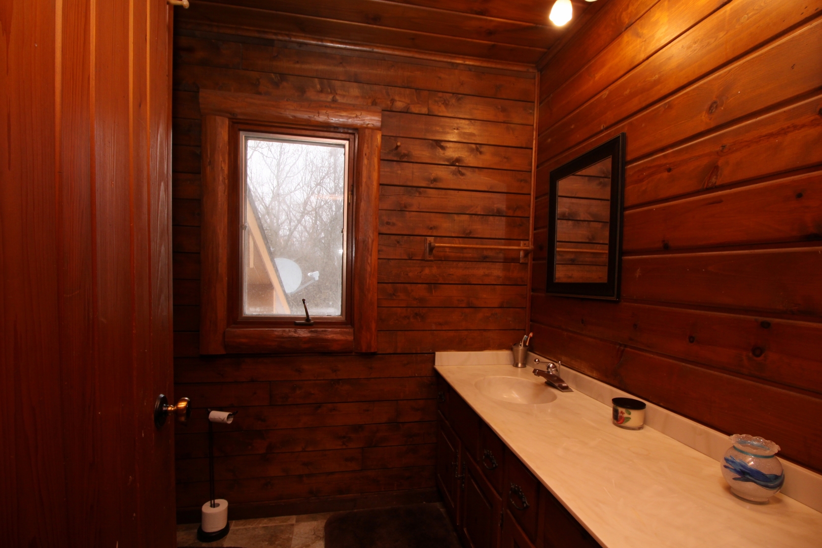 2002 Hawthorn Road Marengo, IL 60152 - Photo 20 of 27 a bathroom with a sink and a mirror