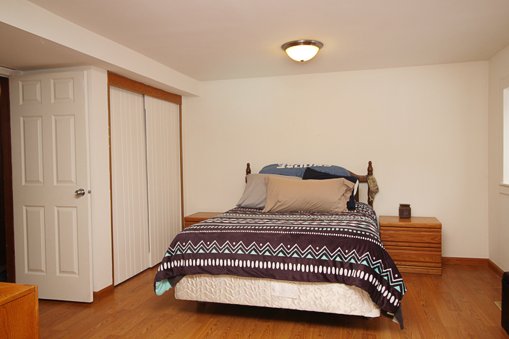 2002 Hawthorn Road Marengo, IL 60152 - Photo 24 of 27 a bedroom with a bed and wooden floor