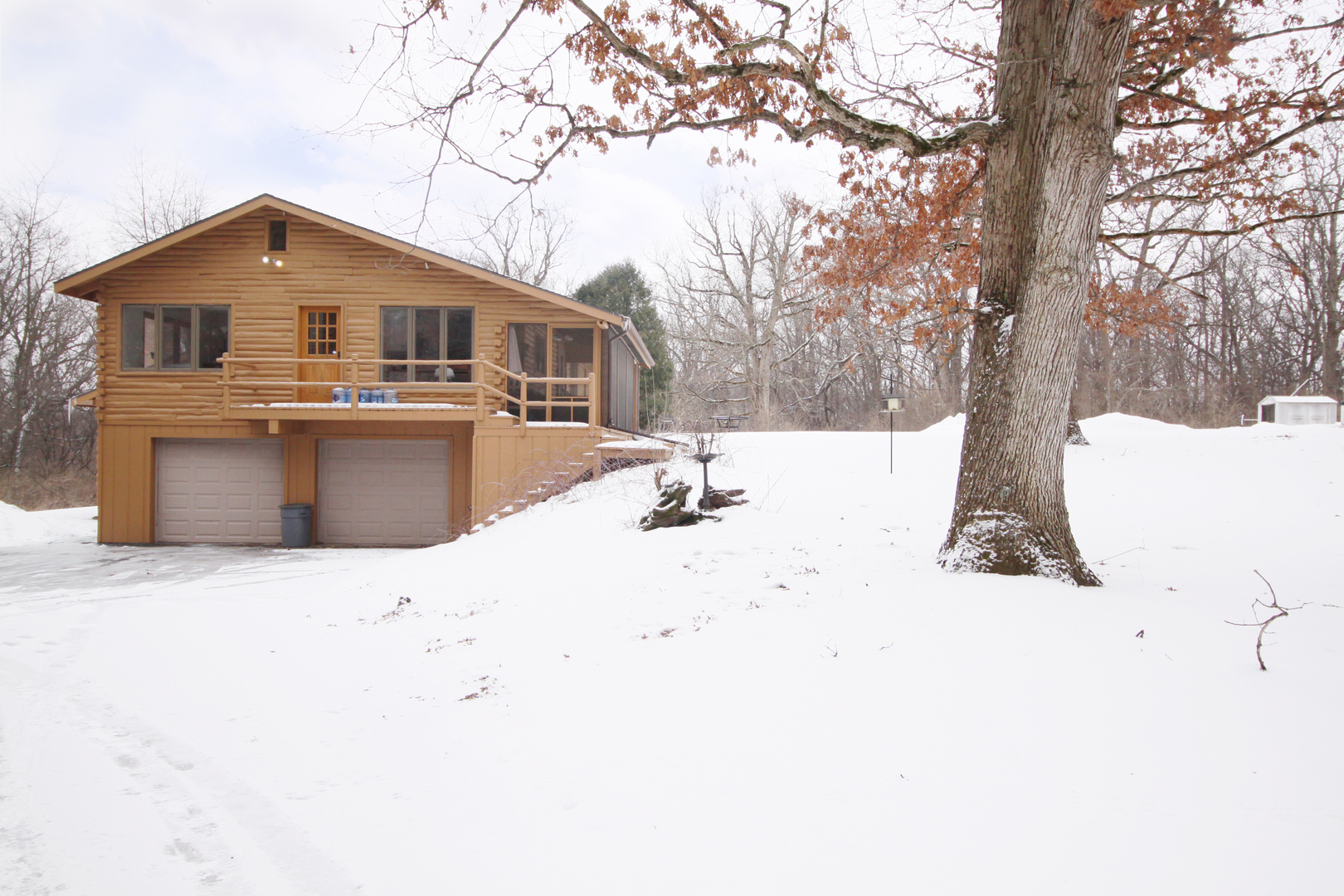 2002 Hawthorn Road Marengo, IL 60152 - Photo 25 of 27 a white house that has a tree in front of it