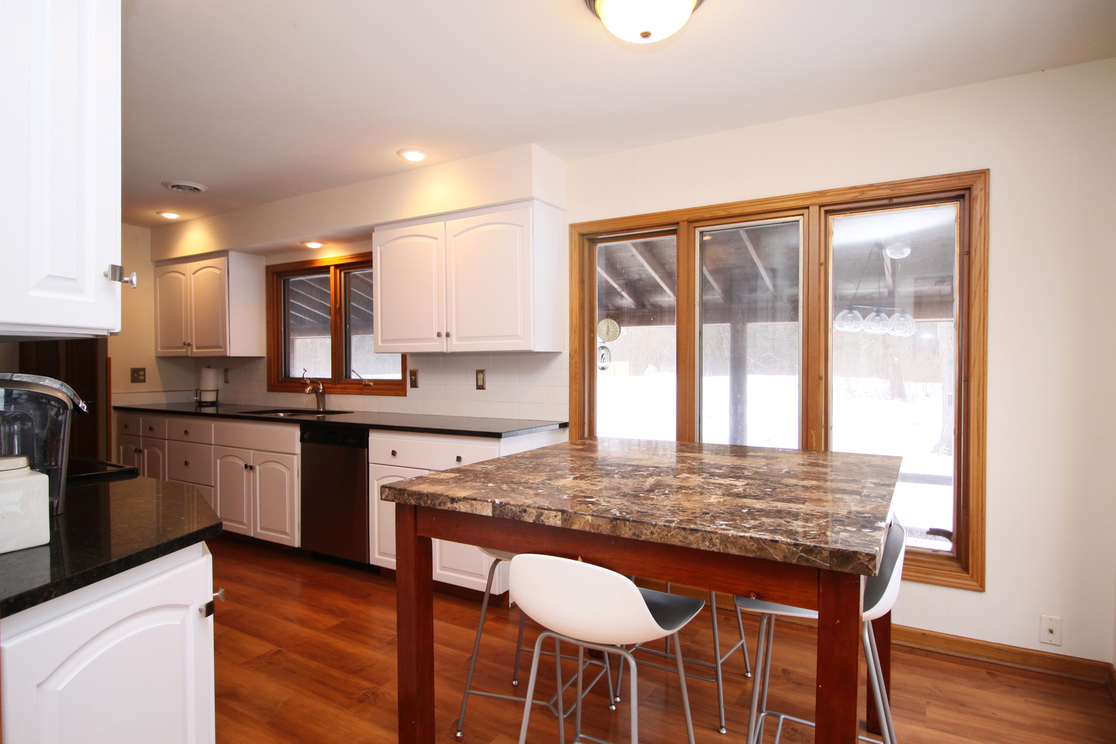 2002 Hawthorn Road Marengo, IL 60152 - Photo 5 of 27 a kitchen with a stove a sink and a refrigerator