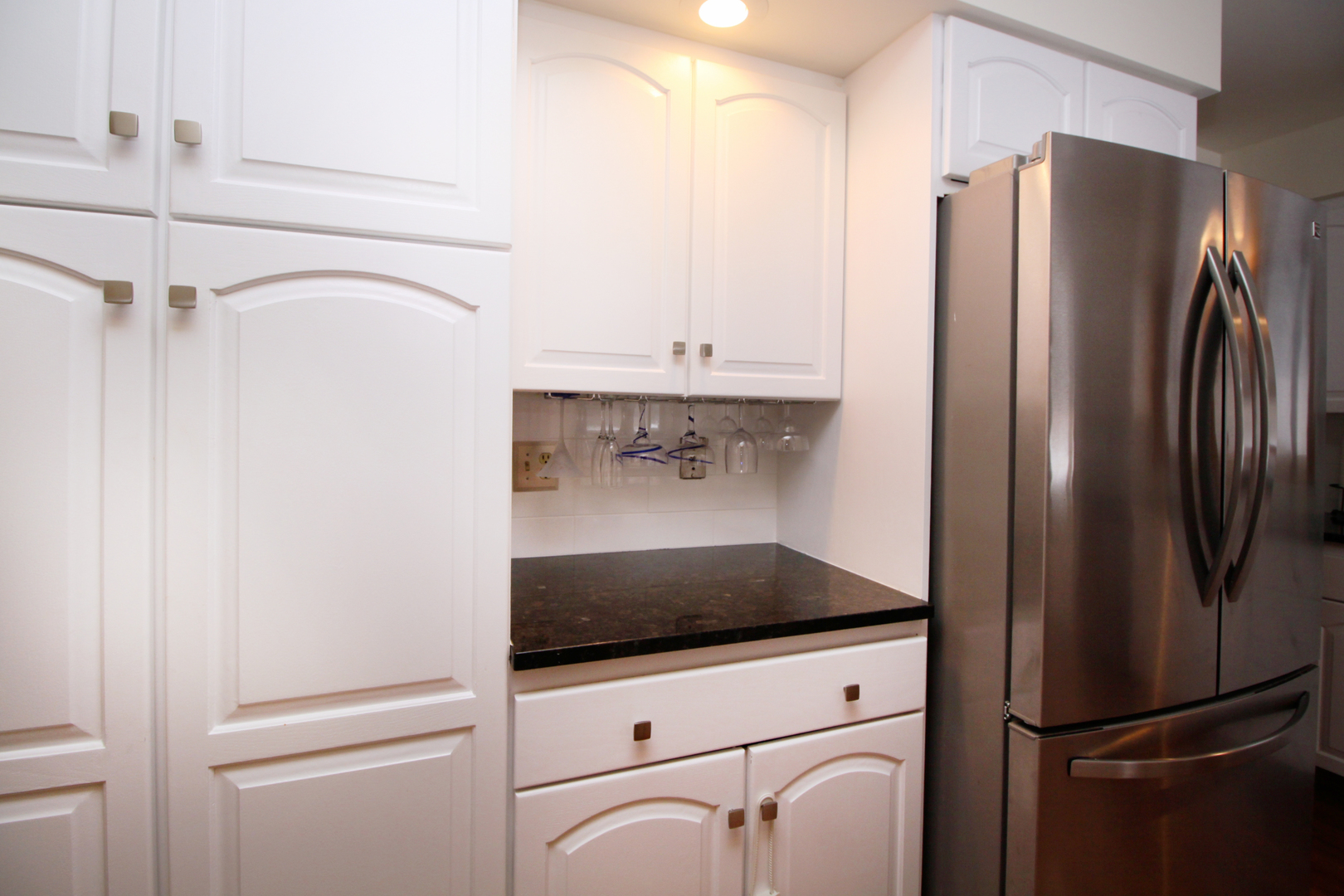 2002 Hawthorn Road Marengo, IL 60152 - Photo 8 of 27 a kitchen with a refrigerator and cabinets