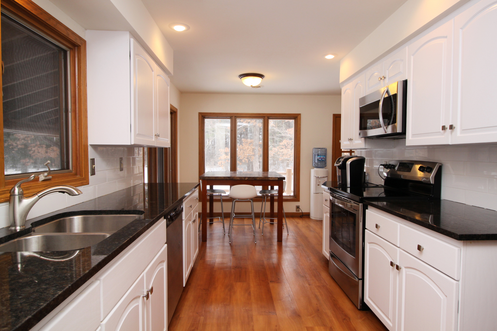 2002 Hawthorn Road Marengo, IL 60152 - Photo 9 of 27 a kitchen with granite countertop a sink a counter top space appliances and cabinets