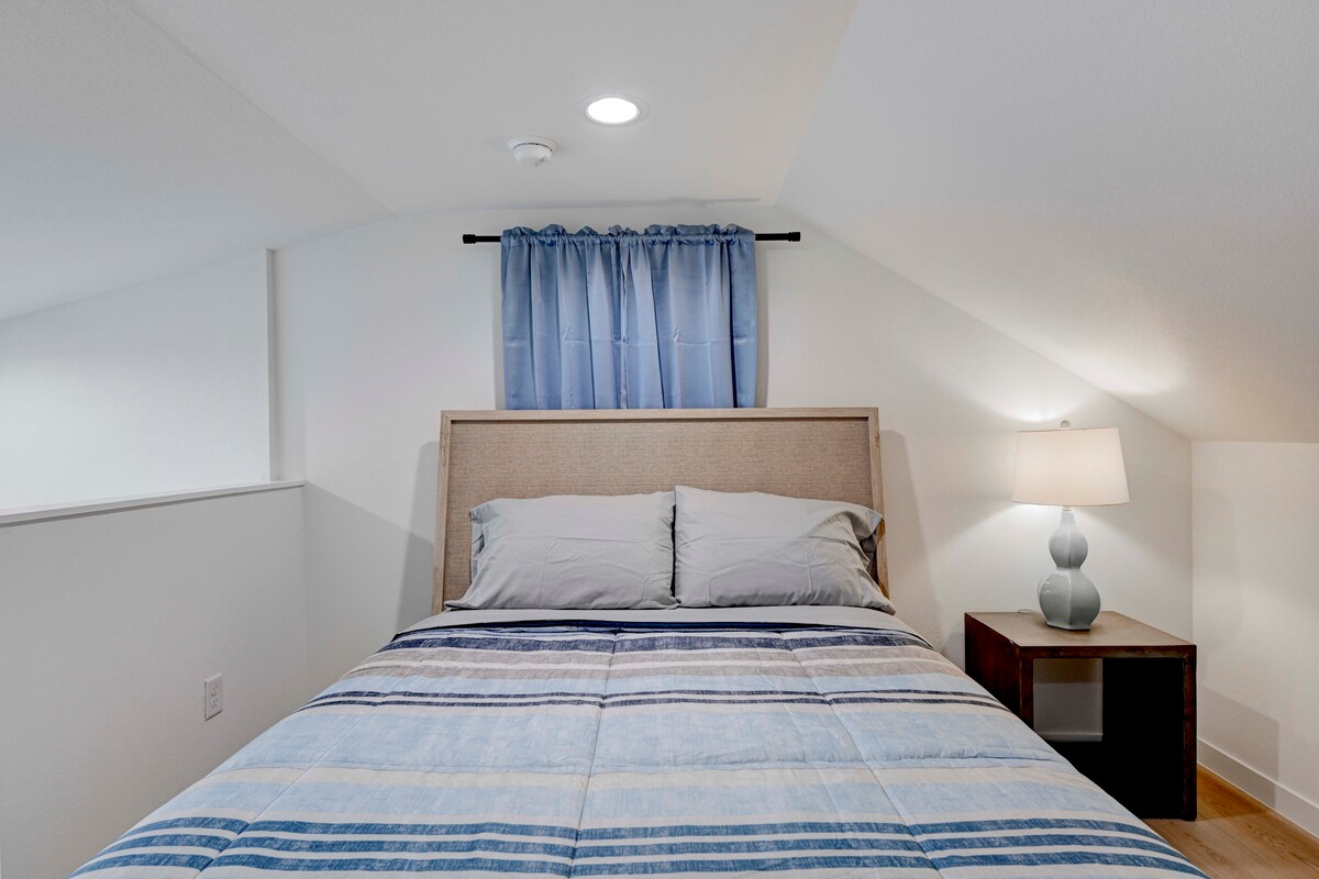 2220 Yellow Jacket Lane, Unit 1 Austin, TX 78741 - Photo 29 of 35 A cozy bedroom retreat, complete with sloped ceilings and recessed lighting.