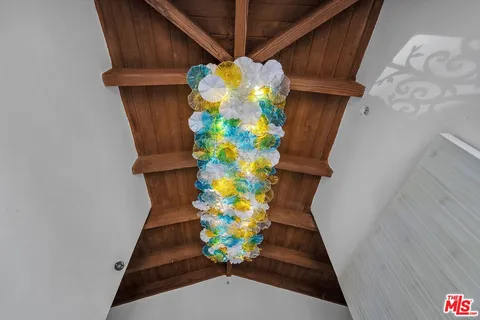 a view of a dining table and chairs in a patio