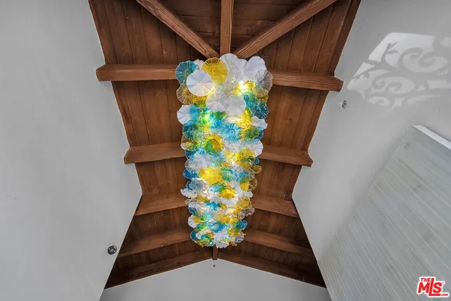 a view of a dining table and chairs in a patio