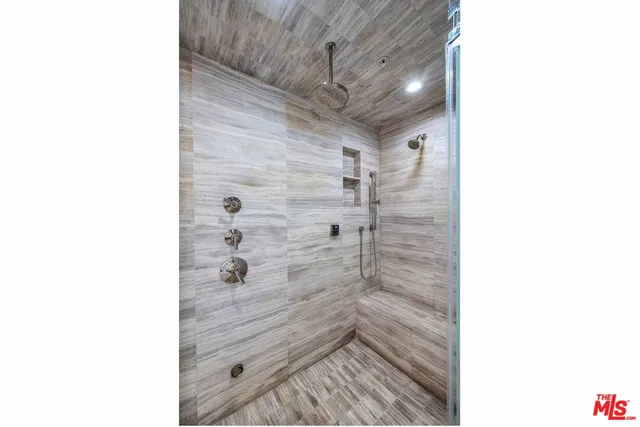 a view of a chairs and table on the wooden deck