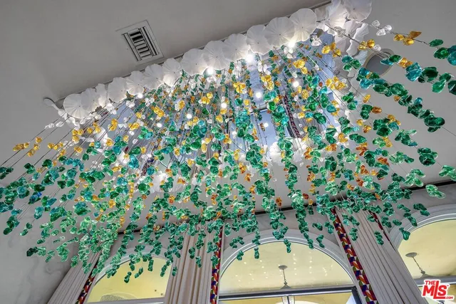 a view of a porch with a table and chairs