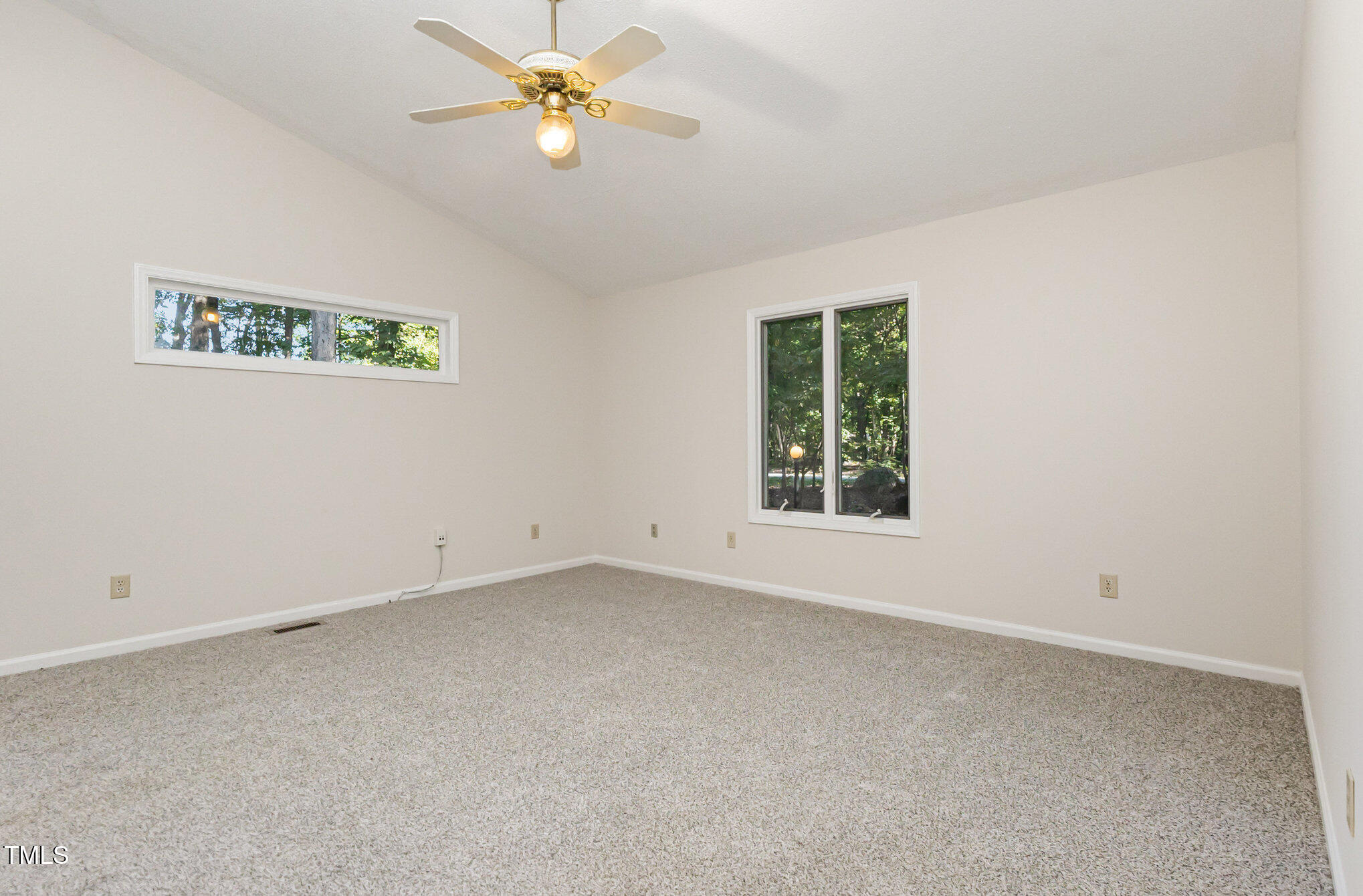 1423 Davis Road Hillsborough, NC 27278 - Photo 11 of 40 an empty room with a window and a fan