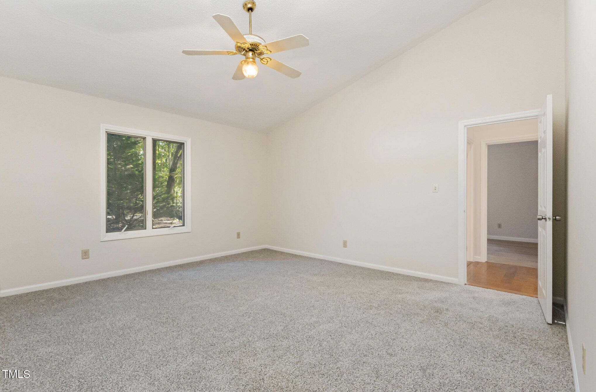 1423 Davis Road Hillsborough, NC 27278 - Photo 12 of 40 an empty room with a window and a fan