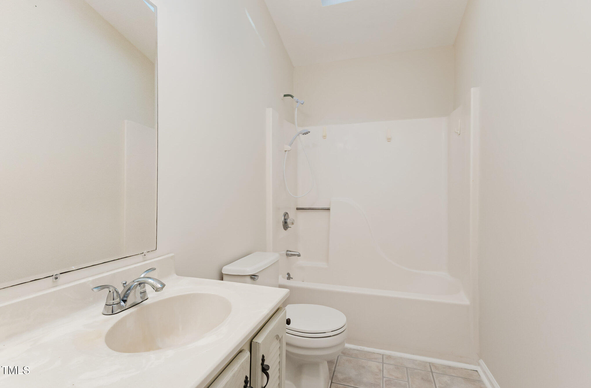 1423 Davis Road Hillsborough, NC 27278 - Photo 16 of 40 a bathroom with a sink toilet and a bathtub
