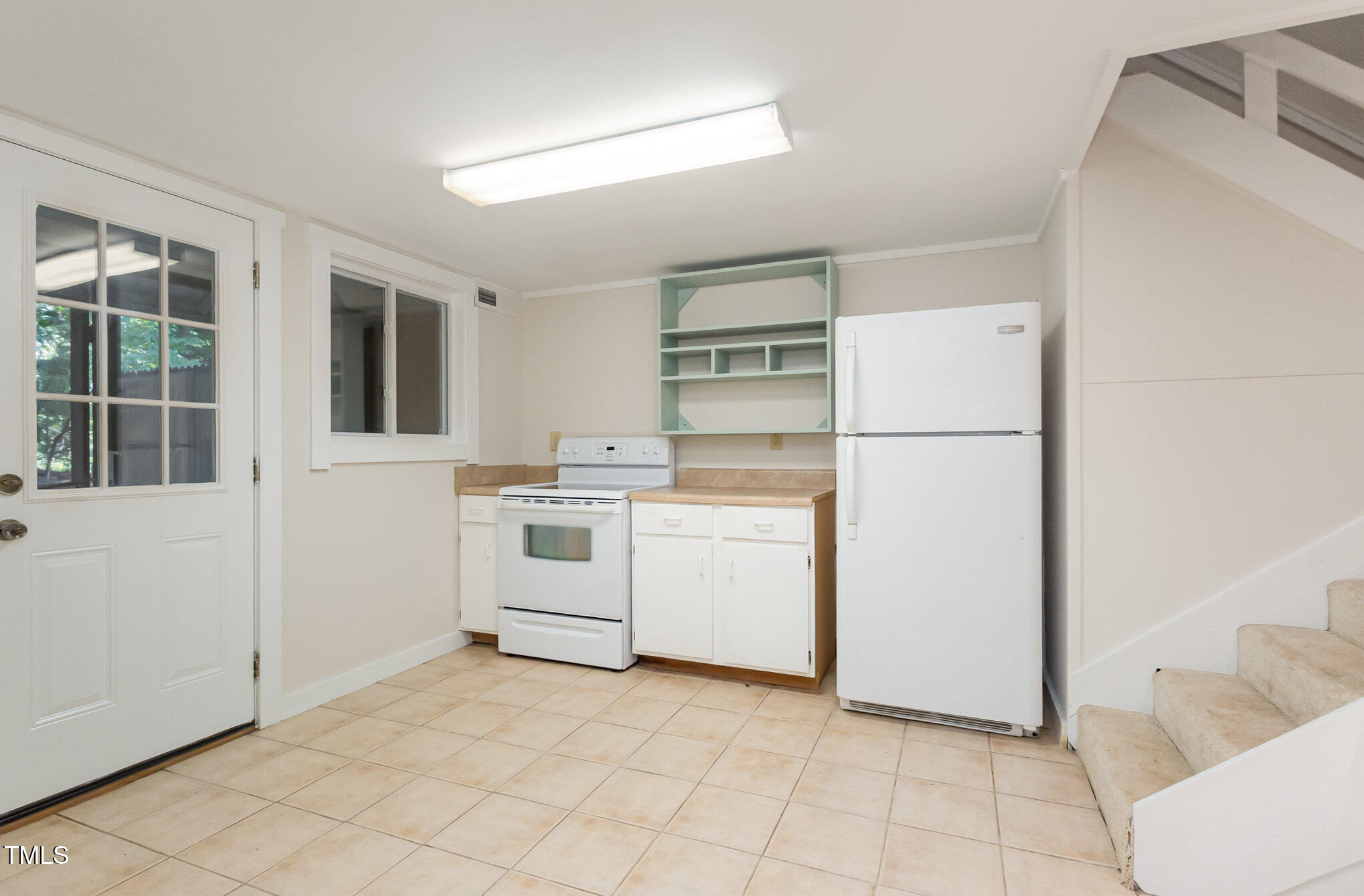 1423 Davis Road Hillsborough, NC 27278 - Photo 19 of 40 a kitchen with white cabinets and white appliances