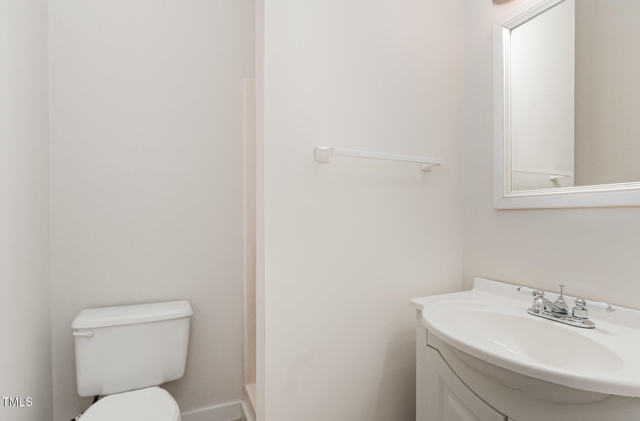 1423 Davis Road Hillsborough, NC 27278 - Photo 21 of 40 a bathroom with a toilet sink and mirror