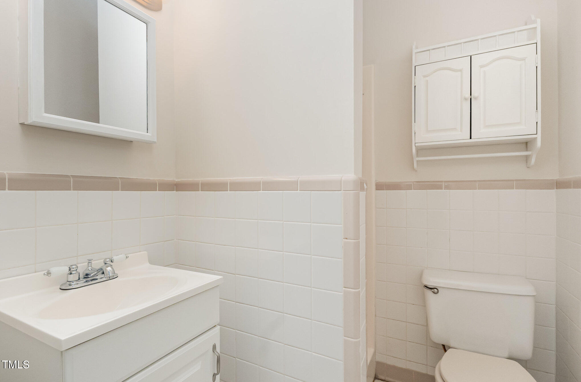 1423 Davis Road Hillsborough, NC 27278 - Photo 27 of 40 a bathroom with a toilet sink and mirror