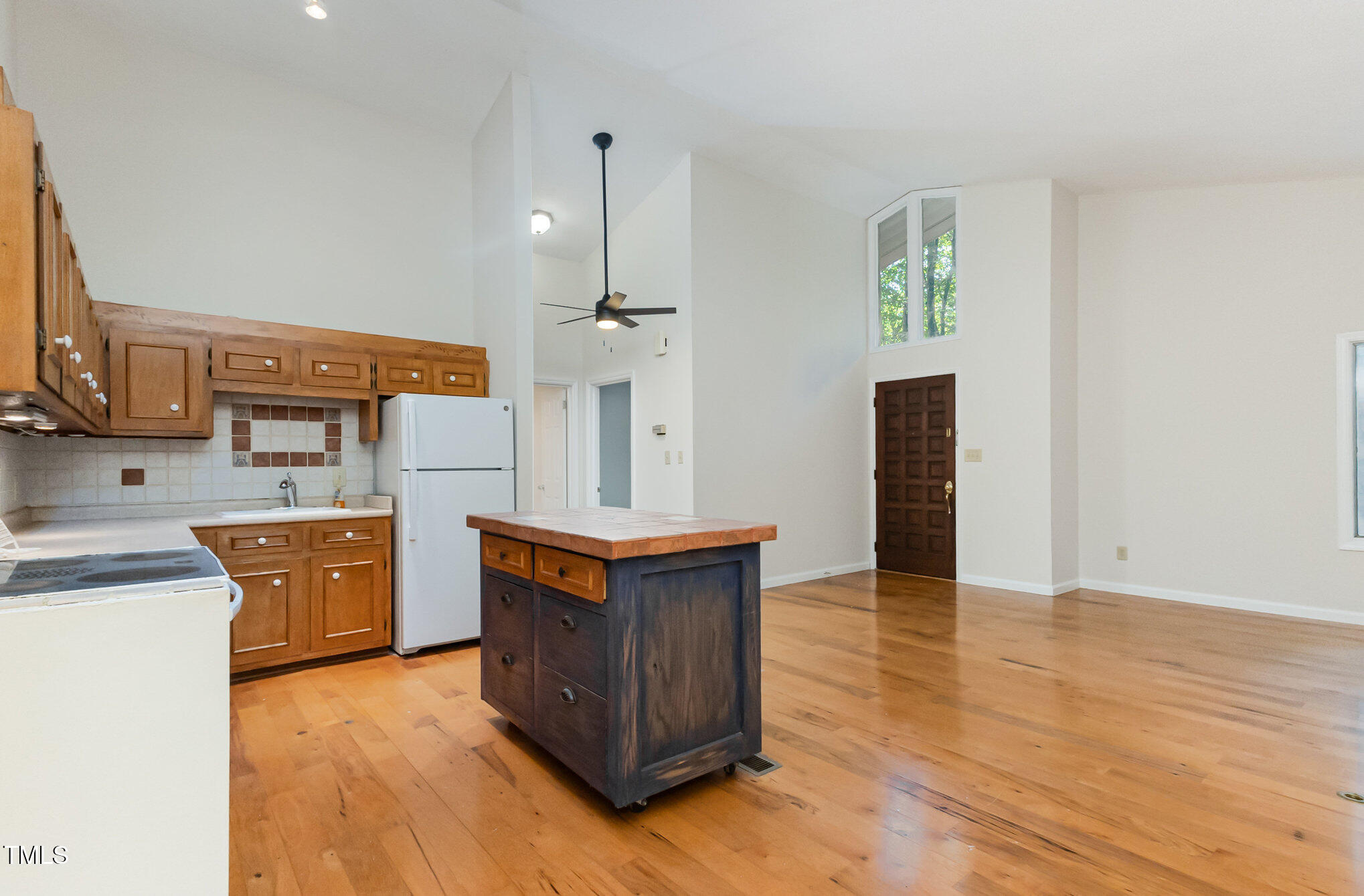 1423 Davis Road Hillsborough, NC 27278 - Photo 7 of 40 a kitchen with stainless steel appliances granite countertop a sink a stove a refrigerator and wooden floor