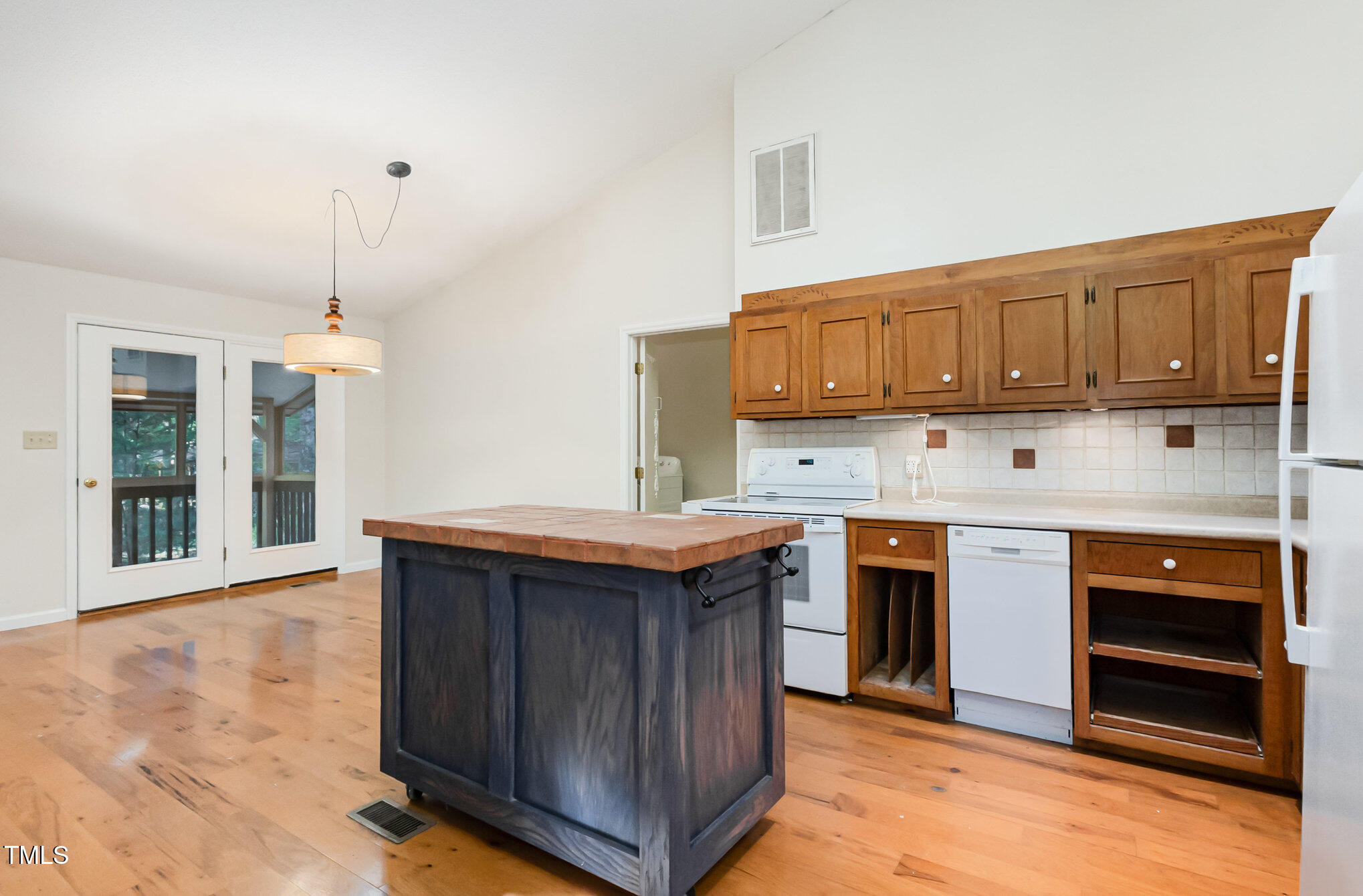 1423 Davis Road Hillsborough, NC 27278 - Photo 9 of 40 a kitchen with stainless steel appliances granite countertop a stove a sink dishwasher and a refrigerator with wooden cabinets