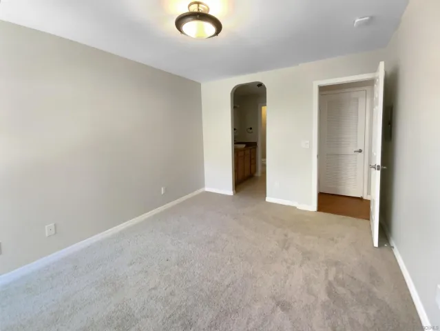 an empty room with closet area