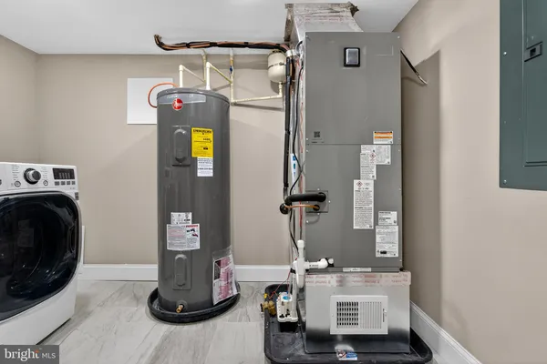 a view of storage and utility room with washer and dryer