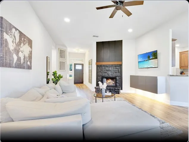 a living room with furniture and a fireplace