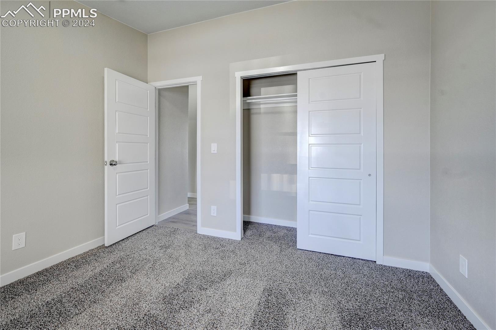 6605 Rio Road Peyton, CO 80831 - Photo 28 of 45 Unfurnished bedroom featuring a closet and carpet